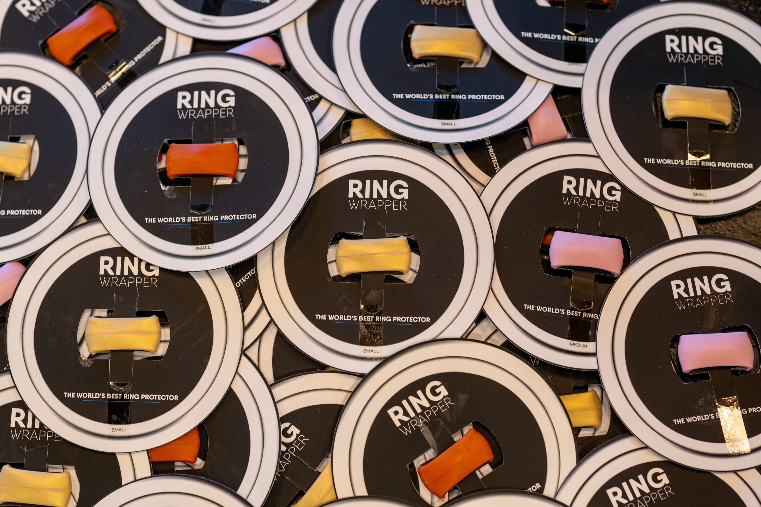 Gold Ring Wrapper silicone ring cover shown worn over a ring