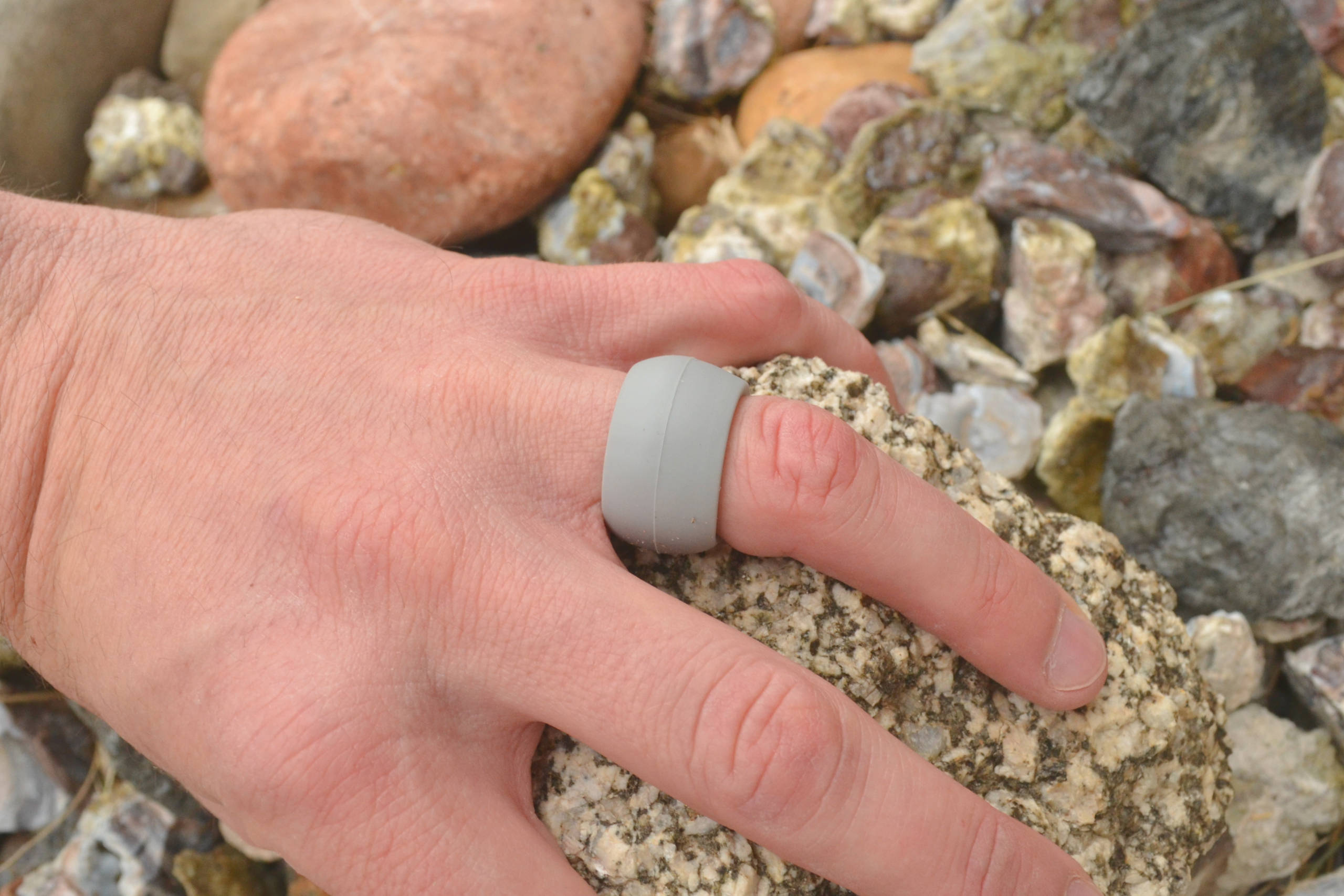Granite Rugged Edition Ring Wrapper silicone ring cover shown worn over a ring