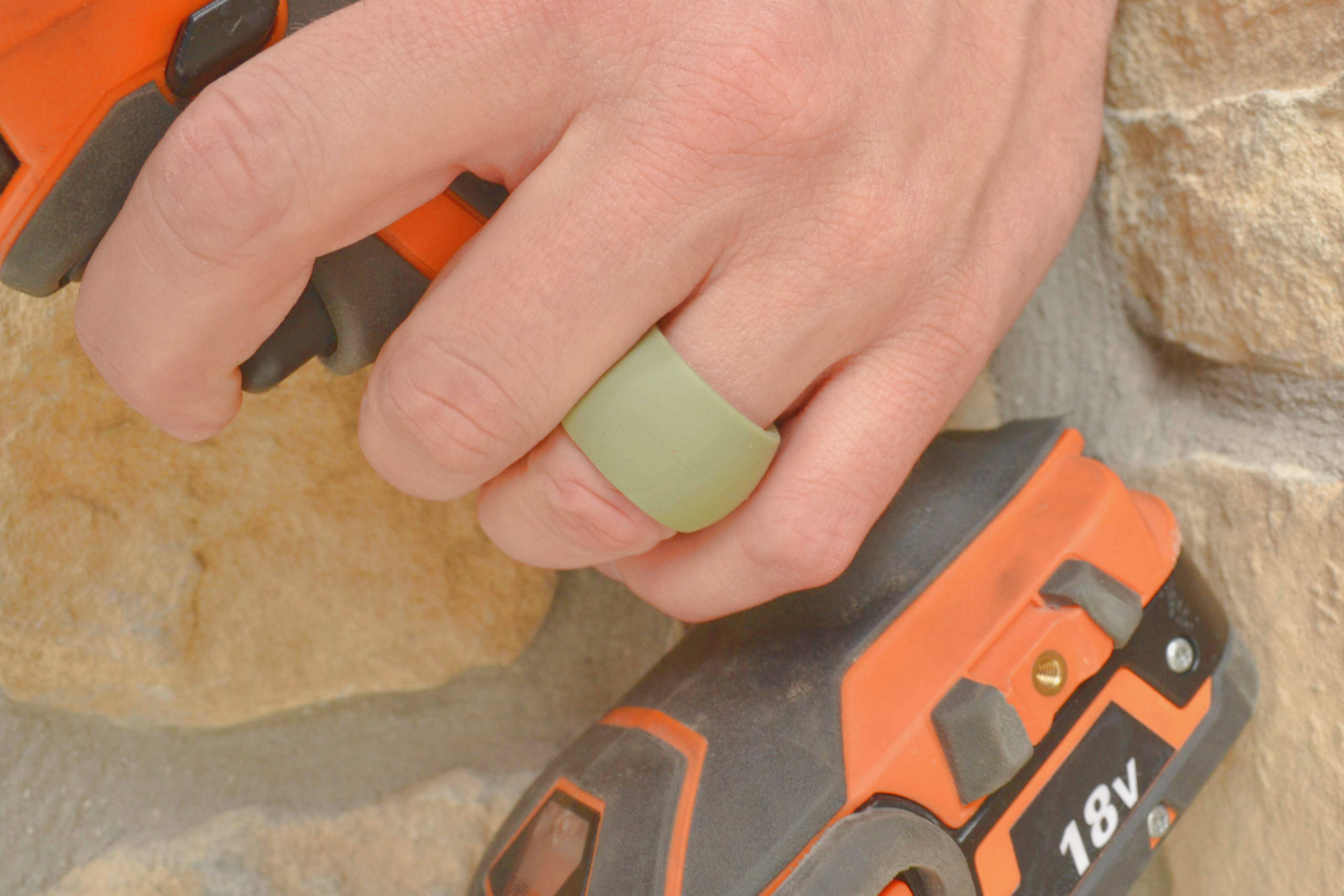 Sage Rugged Edition Ring Wrapper silicone ring cover shown worn over a ring