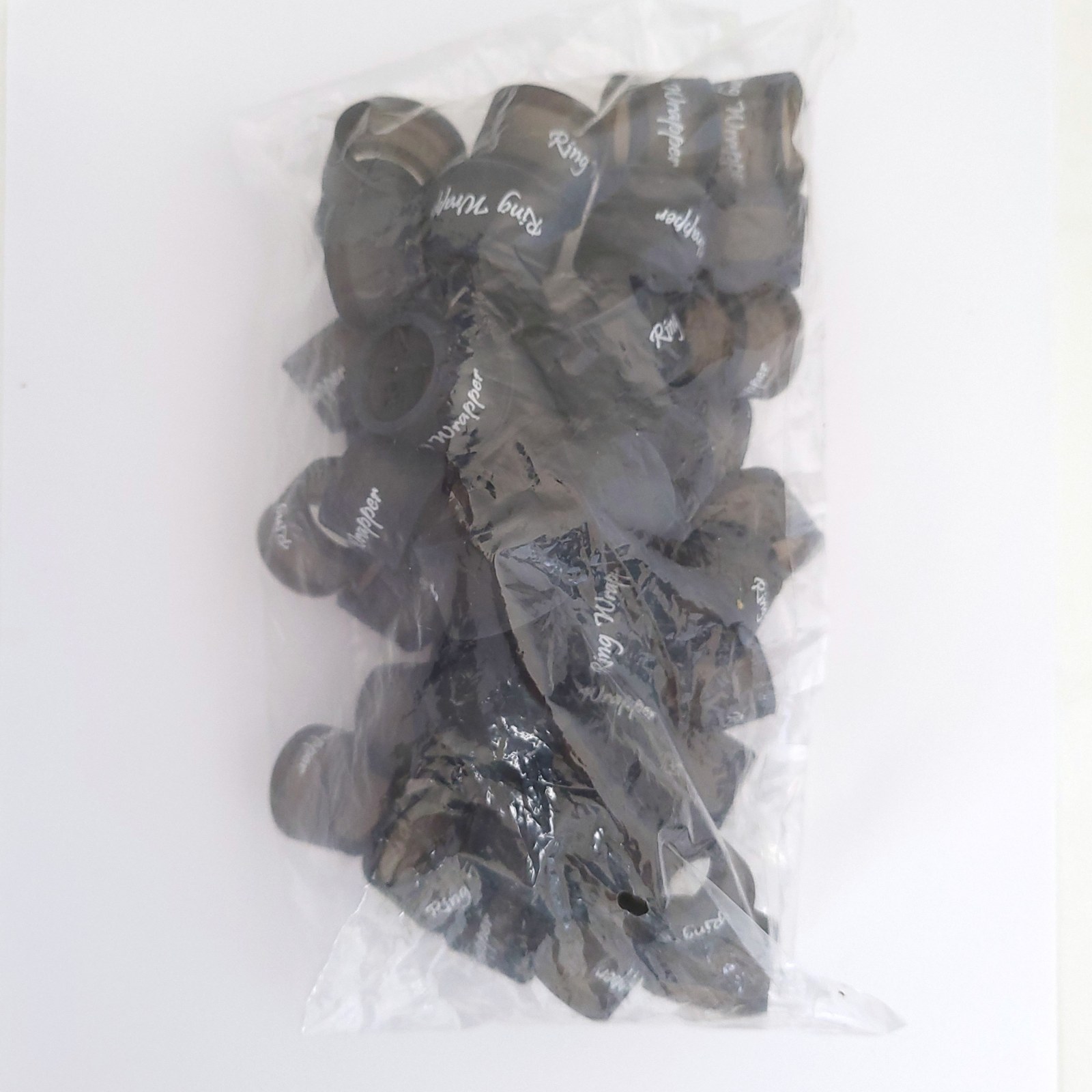 Fifty black Ring Wrapper Original silicone ring covers in a sealed bulk bag