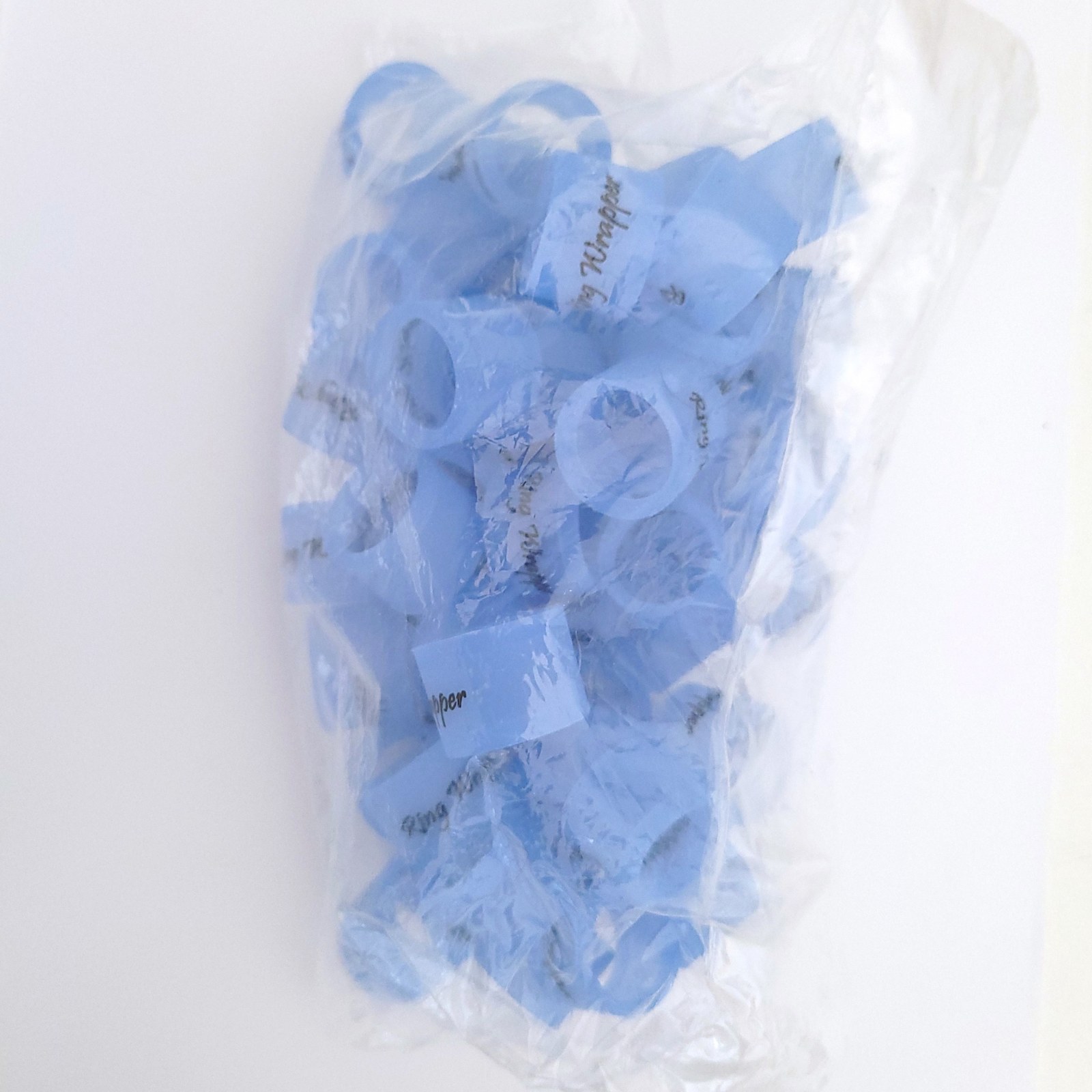 Fifty blue Ring Wrapper Original silicone ring covers in a sealed bulk bag